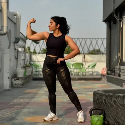 I believe in building a body that is strong and resilient. This pose isn't just for show; it represents the dedication to consistent training and proper nutrition that I teach my clients.