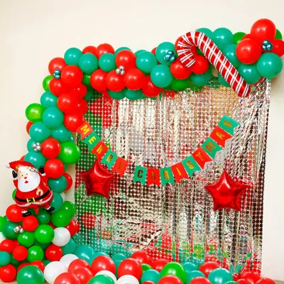 This is our most requested Christmas decoration package, perfect for creating a festive photo booth. The setup includes a dense balloon arch in traditional Christmas colors, a reflective silver curtain, and character foils to bring the holiday spirit to any space.