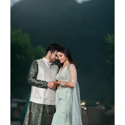 In your arms, I've found my safe haven. A tender moment between the couple during their pre-wedding shoot in the serene hills of Rishikesh.