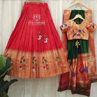 A complete pure Paithani silk lehenga set. The red pleated skirt and golden blouse with woven motifs are paired with a beautiful green Paithani dupatta.