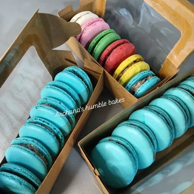 Life is sweet, and my eggless macarons make it even sweeter. This image shows a variety of colorful macarons, perfectly baked with crisp shells and chewy centers, packed in gift boxes.