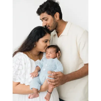 The first family portrait. I love capturing the complete family unit, with both parents showering their new baby with love and affection.