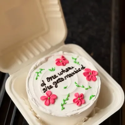 A perfect cake for a "Friends" fan who is getting married! This pretty floral bento cake has the message "d one where she gets married," a sweet nod to the show's episode titles.