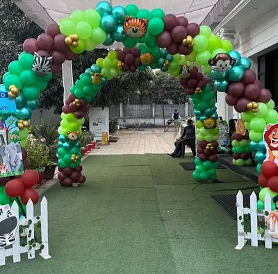 A grand entrance arch for a jungle-themed first birthday party. This video shows the massive balloon arch with animal cutouts, setting an exciting tone right from the start.