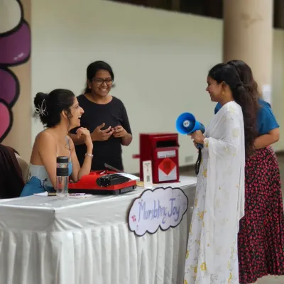 A poet shares her work at our VIBE Festival. We love collaborating with local artists who use their talent to spread joy and support our community events.