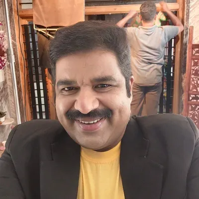 This is me on the set of 'Gouripurada Gayyaligalu'. This black coat holds a lot of memories from my early days as a mimicry artist.