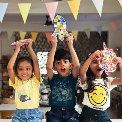 Big dreams, little hands. These three are so excited to show off the mosaic art they made. We offer a variety of shapes, from hot air balloons to rockets and unicorns, so every child can pick their favorite.