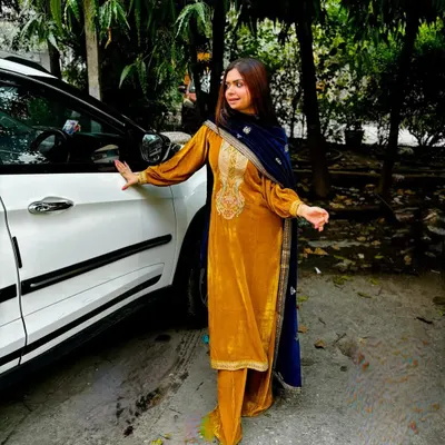 There's nothing like the elegance of a velvet suit in winter. This mustard yellow ethnic ensemble is perfect for festive daytime events, combining traditional embroidery with a rich, modern color.