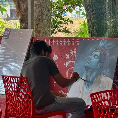 A large acrylic portrait of Lord Krishna, painted on-site. Creating devotional art like this is a spiritual practice for me, and I pour all my reverence into capturing the serene and loving expression of the divine.