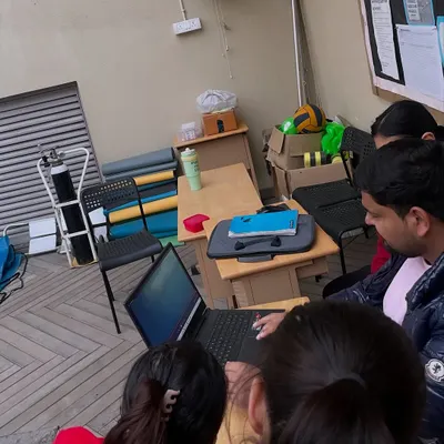 A typical poolside session involves more than just swimming. Here, we are reviewing race footage and performance data to identify areas for technical improvement.
