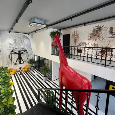 A tribute to the geniuses of architecture. This mural features a montage of iconic structures from masters like Zaha Hadid, Frank Lloyd Wright, and Antoni Gaudí, serving as a source of daily inspiration in our design studio.
