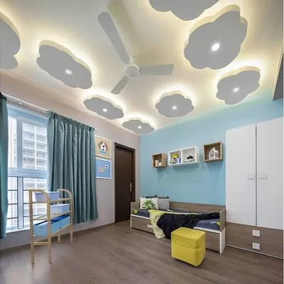 Look up and dream! This simple yet magical false ceiling features backlit cloud shapes that provide soft, ambient lighting for the entire room.