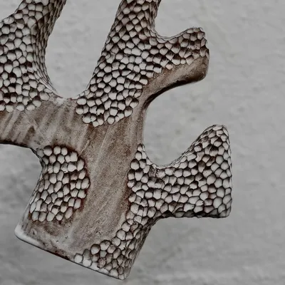 Check out this incredible hand-built vase with a carved honeycomb texture. This piece was made by one of our instructors to showcase different hand-building techniques.
