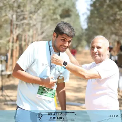 A moment of pure pride. Our founder, Sushil Bhasin, personally awards a finisher's medal at the Jarakabande Eco Ultra. We believe in celebrating every runner's accomplishment.