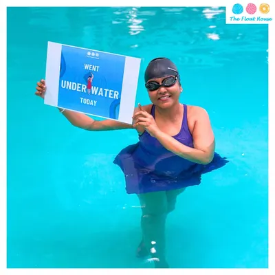 An adult swimmer proudly celebrating her progress. Our Diwali Swimming Camp is open to all ages, helping everyone build confidence in the water.
