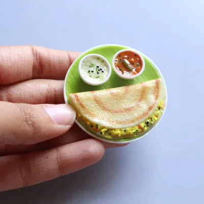 A perfect, crispy miniature masala dosa served with sambar and chutney. This is one of my most requested pieces, bringing back memories of Sunday breakfasts.