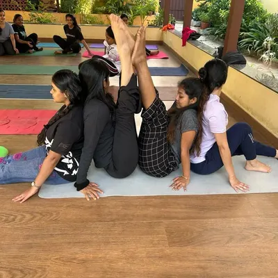 This partner pose is a fun and supportive way to practice a seated forward bend and a backbend simultaneously. It encourages communication and helps both partners achieve a deeper stretch.