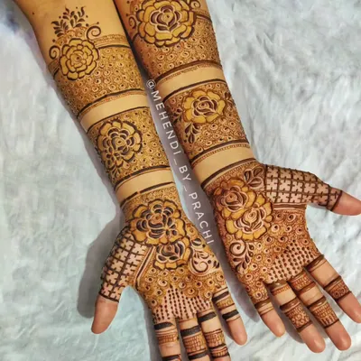 I love blending styles to create something unique. This Indo-Western design combines traditional check-patterns with bold, modern floral bands for a bride who wanted a contemporary yet intricate look.