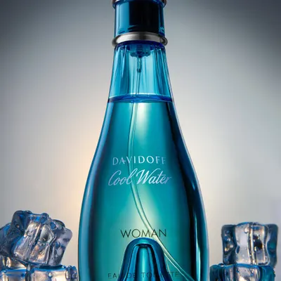 A low-angle shot of the iconic Davidoff Cool Water perfume. I used a dark, moody lighting setup with ice cubes to emphasize the "cool" aspect and give the bottle a grand, heroic presence.