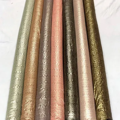 I've rolled these shimmer foil georgette fabrics to show the beautiful range of metallic and earthy tones available. The crushed texture catches the light beautifully, adding dimension to the material.