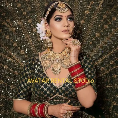 A stunning bridal look I created, featuring a dark green lehenga, dramatic smokey eye makeup, and heavy gold jewellery.