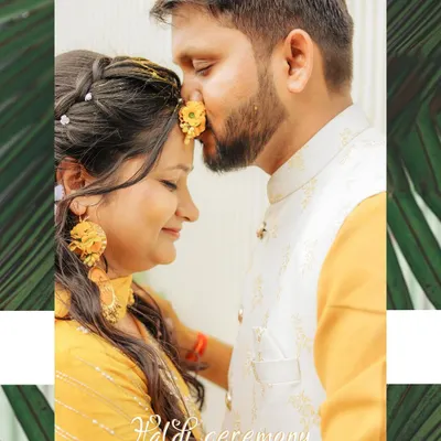 A sweet, intimate moment during a Haldi ceremony. The groom applies haldi to the bride's forehead, and the close-up shot captures the tenderness and tradition of the ritual.