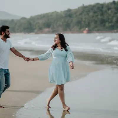 A classic romantic walk along the shoreline. I guide couples into natural poses that feel comfortable and look beautiful on camera.