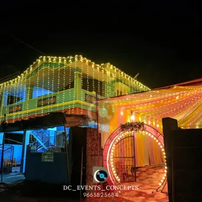 We bring the celebration to your home with festive house lighting and a beautifully decorated entrance pandal. The warm lights create a welcoming glow for any auspicious occasion.