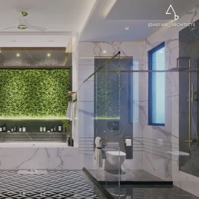 This bathroom is designed to feel like a daily escape. The combination of a lush green wall, a freestanding tub, and contrasting marble creates a vibrant, spa-like sanctuary right at home.