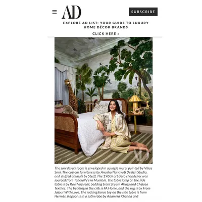 A screenshot from the Architectural Digest feature on the nursery I designed. The article highlights the custom furniture and beautiful jungle mural that define the space.