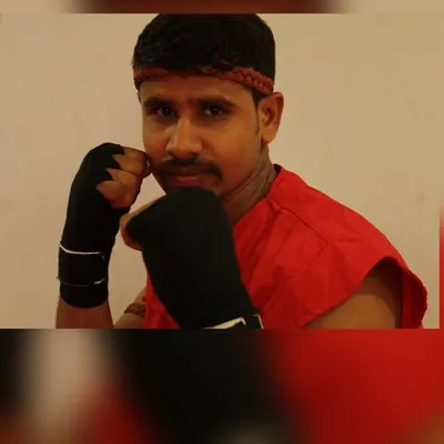 A headshot of me, Kru Chandra Kumar. I am ready to help you start your combat sports journey.