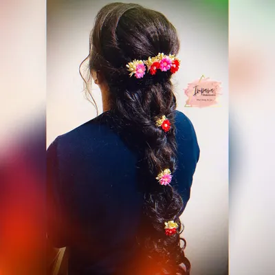 This advance hairstyle with a messy braid and delicate floral accessories was created during one of my hairstyle classes. I teach the techniques to create volume, texture, and secure accessories perfectly.