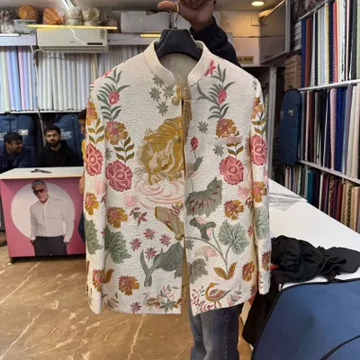 An example of a unique custom piece I created. This is a Jodhpuri jacket with a bold, hand-painted floral and tiger design. If you want something truly one-of-a-kind, I can make it happen.