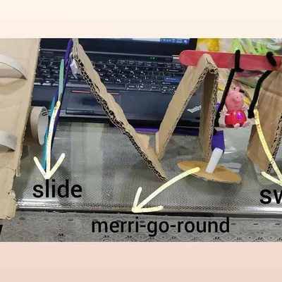We brought the playground home by building our own miniature version from cardboard. This STEAM project included a working see saw, a slide, and a swing, teaching the kids basic mechanics and engineering principles while they built their dream park.