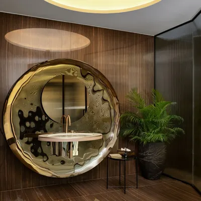 A washroom where elegance meets artistry. The sink, a breathtaking showstopper, stands as a testament to refined taste, while the exquisite Italian tiles from Fiandre weave a harmonious tapestry of design.