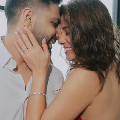 A moment of pure, uninhibited laughter between a couple at Soho House Mumbai. This close-up shot captures the genuine joy and connection that is the essence of their relationship.