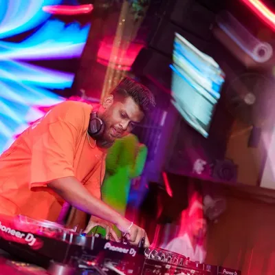 In the zone at Happy Brew, surrounded by motion and light. This action shot captures the high energy environment of a live club set.