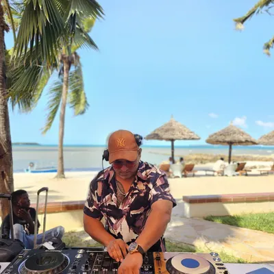 DJing on a beautiful beach in Tanzania. For destination parties, I curate a special mix of Afrohouse, house music, and commercial hits to complement the stunning location.