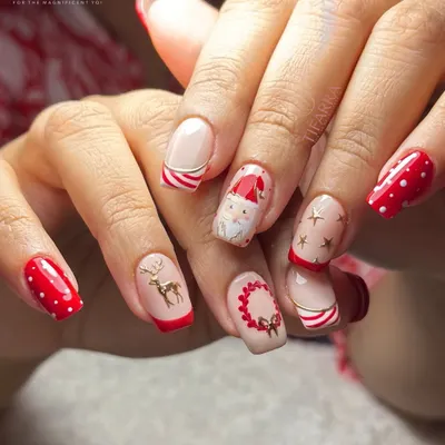 Christmas magic, nail edition. A playful and intricate set featuring hand-painted Santa, reindeer, candy cane stripes, and polka dots.