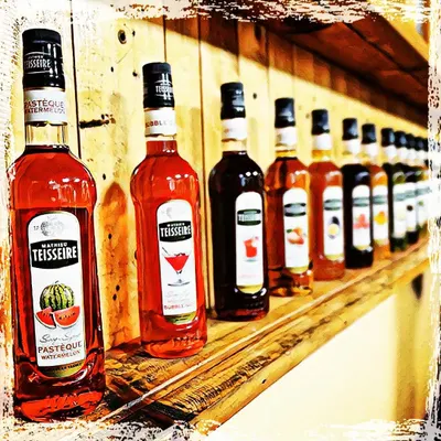 A lineup of Mathieu Teisseire syrups. We work with brands like this to develop recipes and training modules that highlight their range and quality.