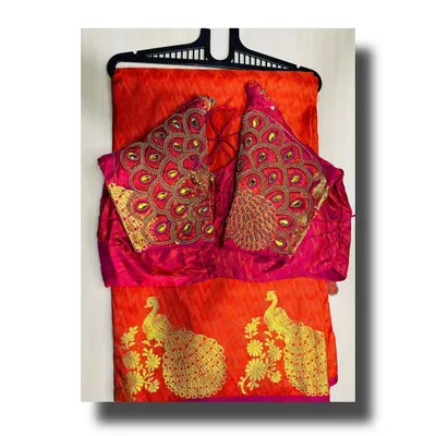 This vibrant red silk saree is paired with a stunning blouse featuring heavy peacock feather embroidery on the sleeves. Renting this set gives you a complete, coordinated look for any wedding or festive occasion.