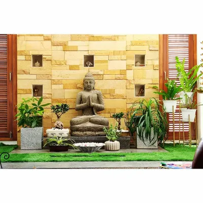 I designed this peaceful indoor courtyard to be a meditation space. It features a Buddha statue, bonsai trees, and other carefully selected plants to create a calm atmosphere.