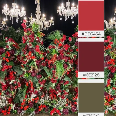 A color palette inspired by passion and luxury. This mood board showcases a theme of deep reds and rich burgundies, set against dark foliage and illuminated by crystal chandeliers, perfect for a glamorous evening reception.