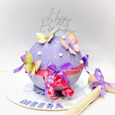 This beautiful butterfly-themed piñata cake has a surprise mixed fruit cake hidden inside its chocolate shell. It comes with a decorated wooden hammer for the big reveal.