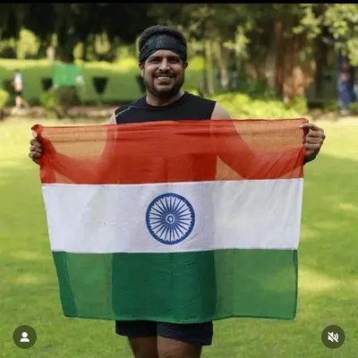 A member holding the Indian flag with pride after an Independence Day run. The feeling of patriotism combined with the runner's high is incredible.