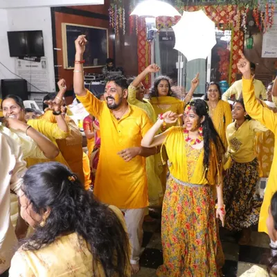 The happy couple surrounded by a sea of yellow at their Haldi function. I love organizing dance and games for these events to make them lively and unforgettable.