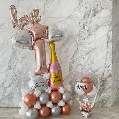 The perfect surprise for a first anniversary. This set includes a 6-foot-tall balloon arrangement and a custom hot air balloon gift basket filled with fresh flowers and chocolates.