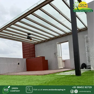 This custom-designed glass pergola at an Assetz Soul & Soil villa provides shade and rain protection without blocking natural light. The structure is made from a powder-coated MS frame with a toughened glass roof, perfect for Bangalore's weather.
