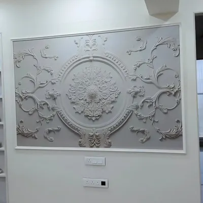 This framed 3D wallpaper features an ornate, classical design. It acts like a piece of sculpted art, adding a touch of European elegance to the room.