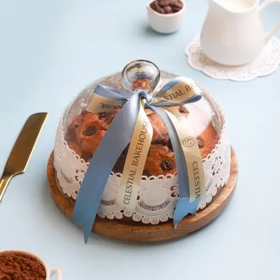 Our Marvel Marble Cake presented in its most elegant form, under a 7-inch glass dome with a handcrafted wooden base. It’s more than a cake; it’s a centerpiece and a memory.